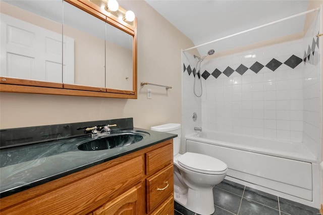 bathroom featuring tub / shower combination, vanity, toilet, and tile patterned floors