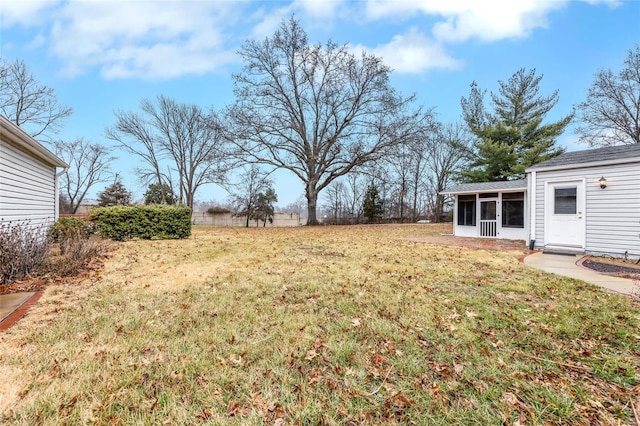 view of yard with a sunroom