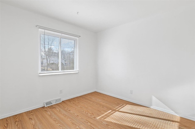 empty room featuring hardwood / wood-style flooring