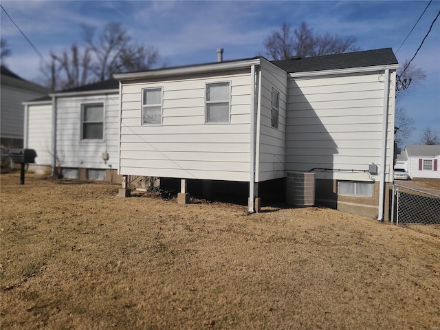 rear view of house with a lawn