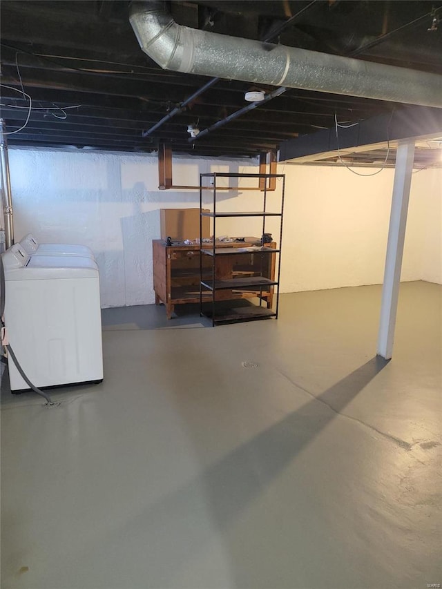 unfinished basement featuring independent washer and dryer