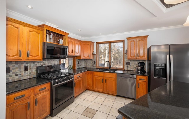 kitchen featuring sink, light tile patterned flooring, ornamental molding, and appliances with stainless steel finishes