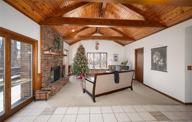 living room with beam ceiling, light tile patterned floors, wood ceiling, and a fireplace