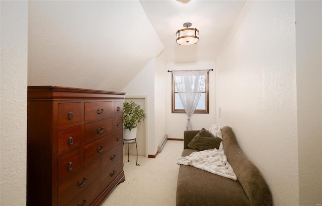 carpeted bedroom featuring lofted ceiling, a baseboard heating unit, and ornamental molding