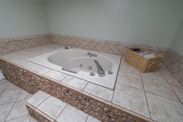 bathroom featuring tile patterned flooring and tiled tub