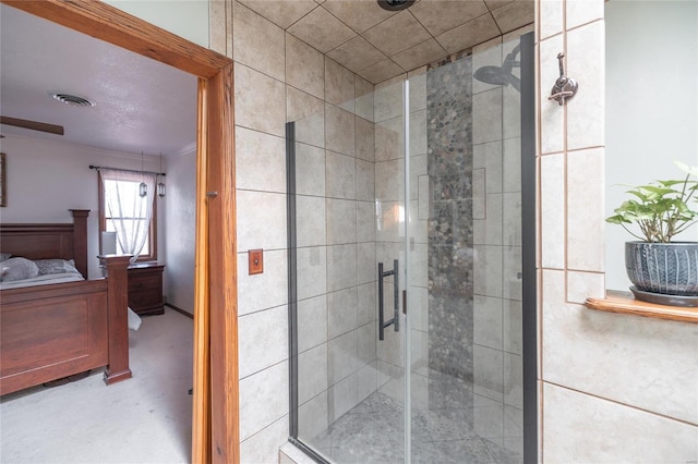 bathroom featuring a shower with shower door