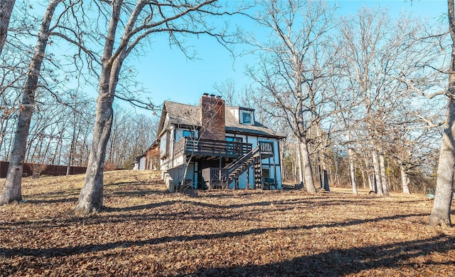 rear view of house featuring a deck