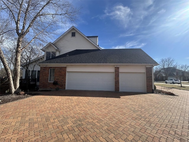 view of side of property featuring a garage