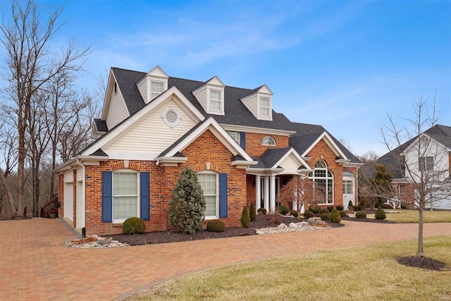 view of front of property featuring a garage and a front yard