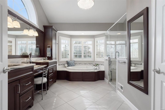 bathroom featuring vanity, plus walk in shower, a chandelier, and tile patterned flooring