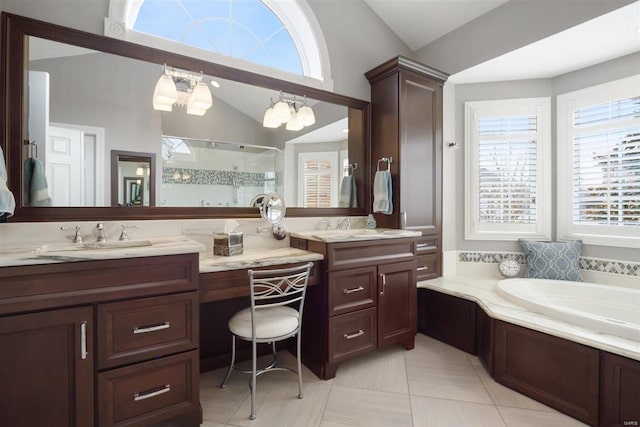 bathroom with lofted ceiling, vanity, tile patterned floors, and separate shower and tub