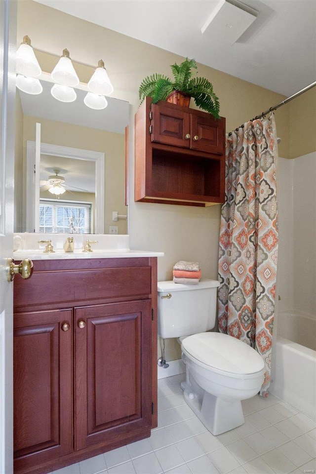 full bathroom featuring vanity, shower / tub combo with curtain, tile patterned floors, and toilet