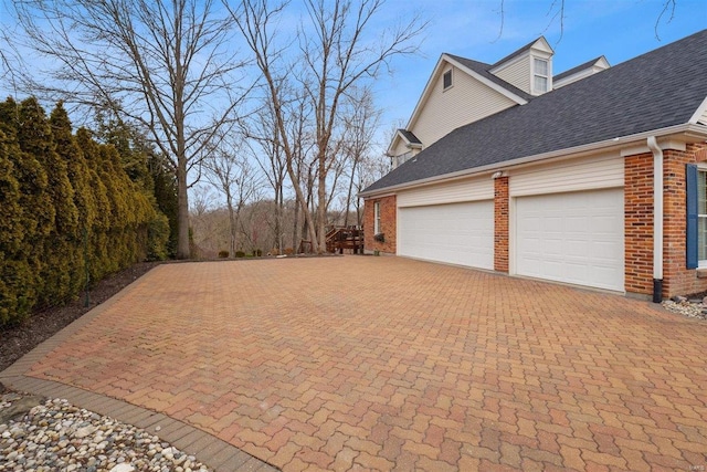 view of side of home with a garage