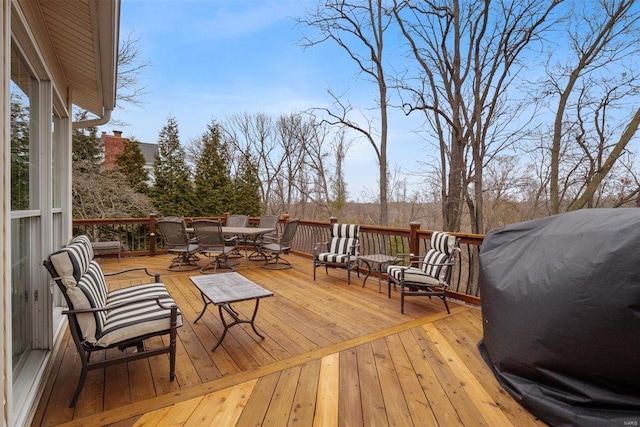 wooden terrace featuring grilling area