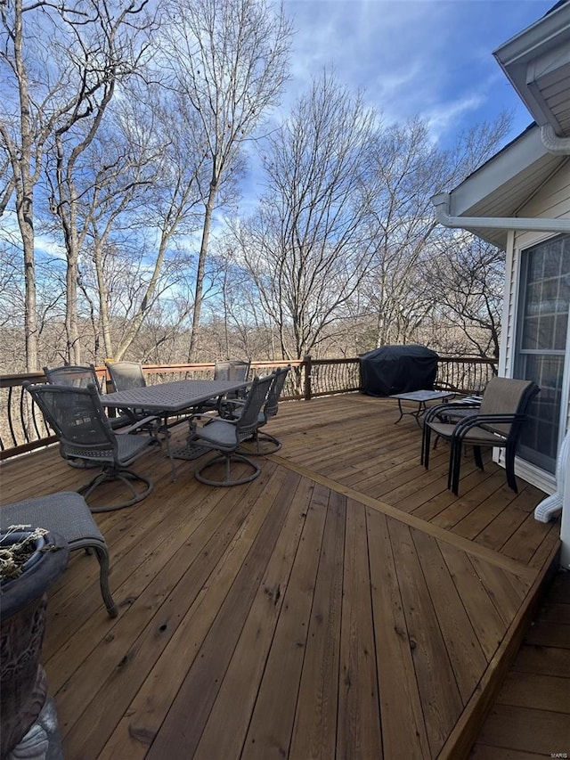 wooden terrace featuring area for grilling