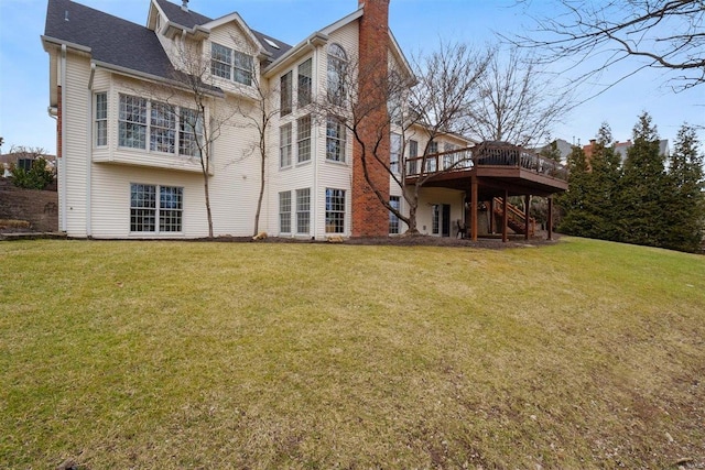 back of house featuring a yard and a deck