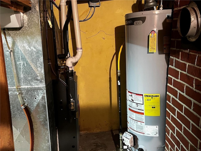 utility room featuring water heater and heating unit