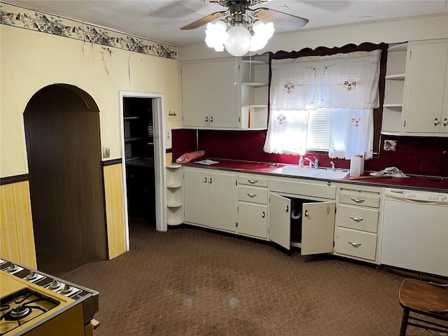 kitchen with white cabinetry, dishwasher, and sink