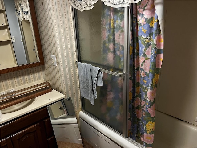 bathroom with vanity and bath / shower combo with glass door