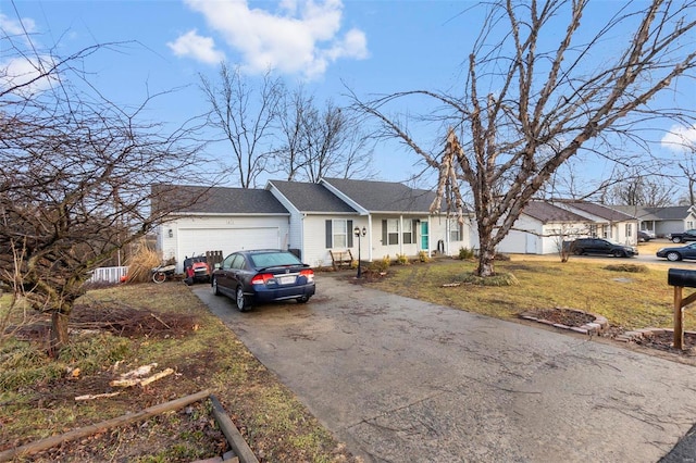 single story home featuring a garage and a front yard