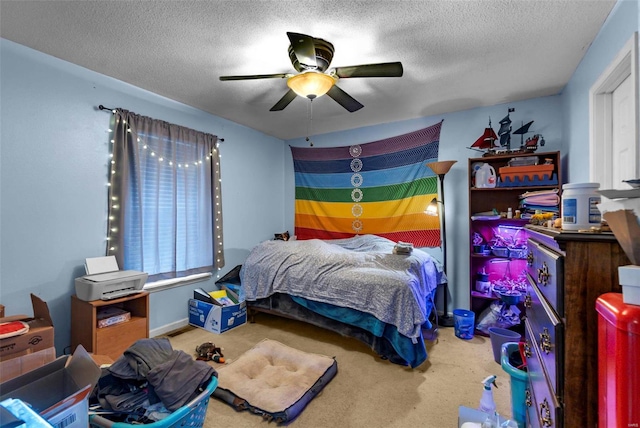 carpeted bedroom with multiple windows, ceiling fan, and a textured ceiling