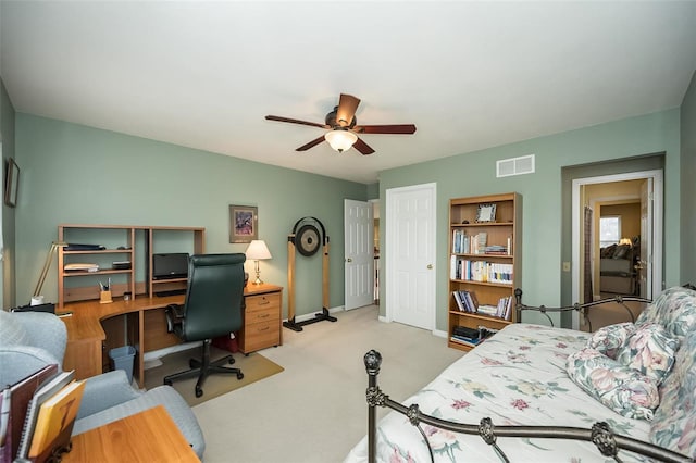 bedroom with baseboards, visible vents, ceiling fan, and carpet flooring