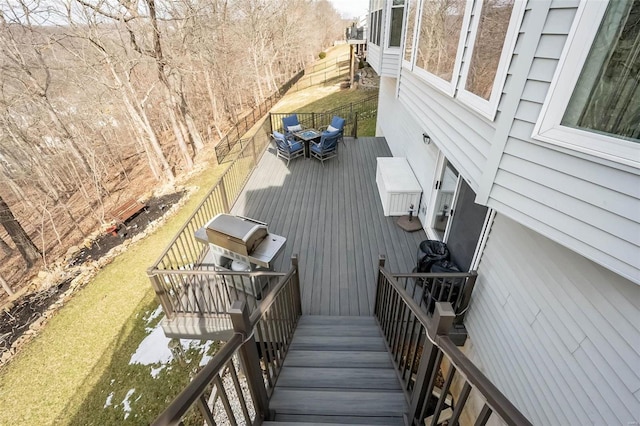 wooden deck featuring area for grilling