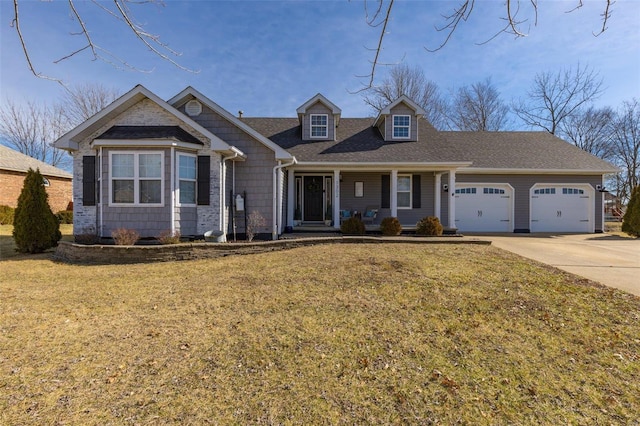 view of front of property featuring a garage and a front yard