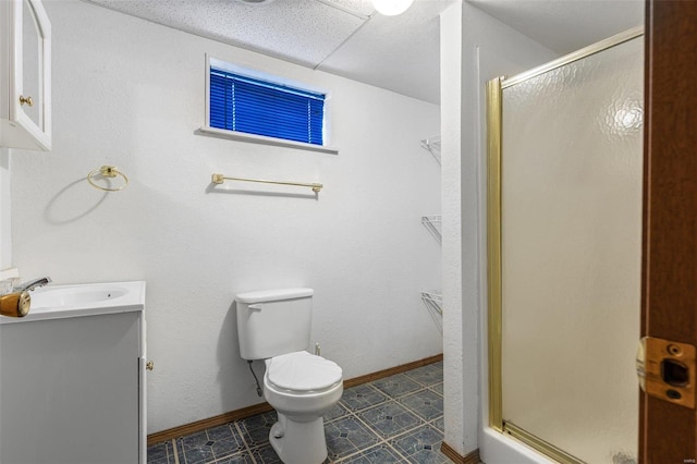 bathroom with vanity, toilet, and walk in shower