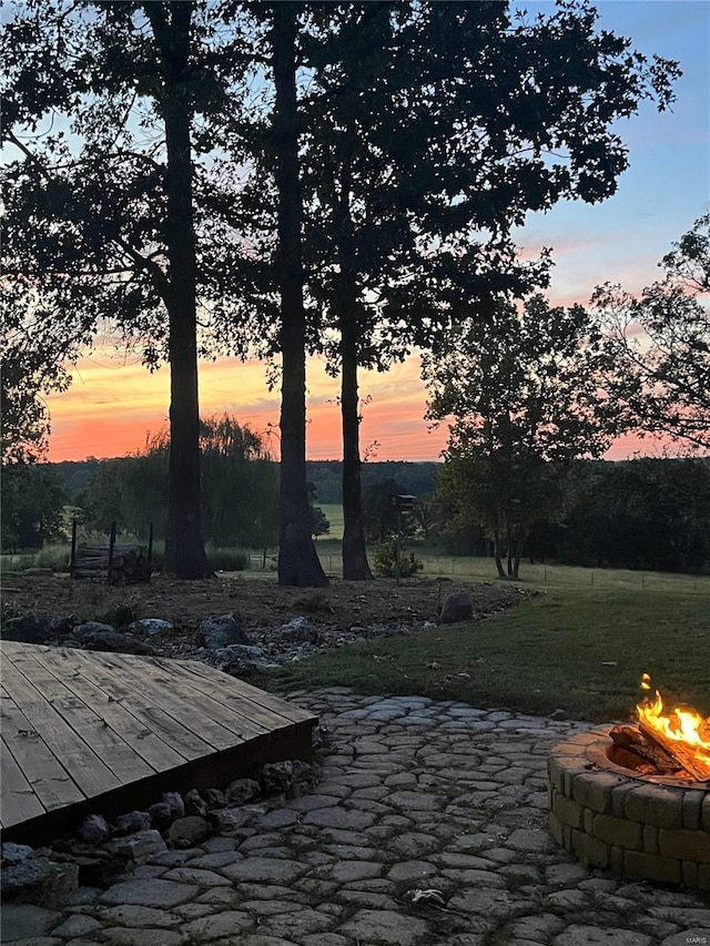 patio terrace at dusk with an outdoor fire pit