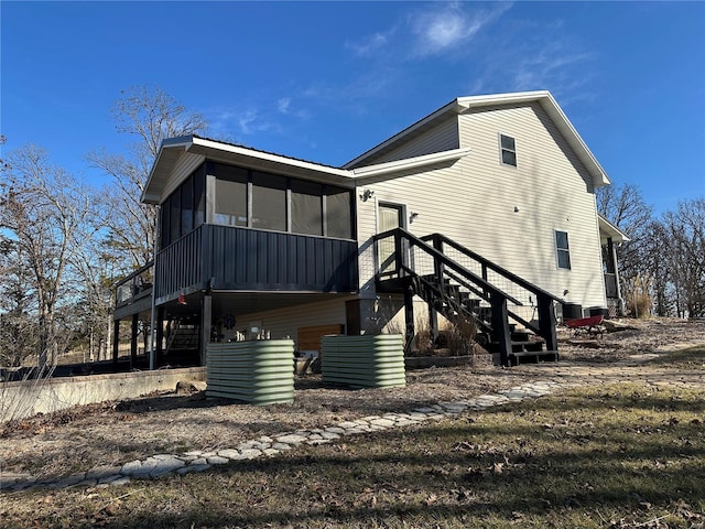 back of house with a sunroom and central air condition unit