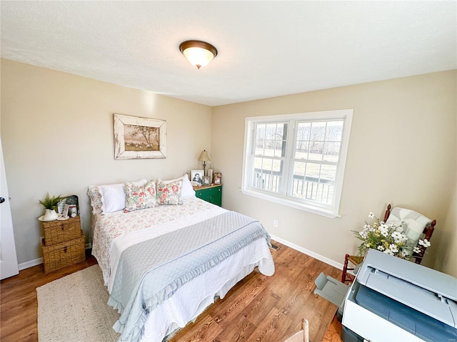 bedroom with wood-type flooring