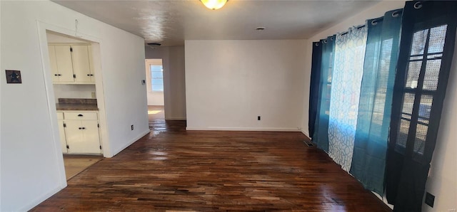 hall featuring dark wood-type flooring