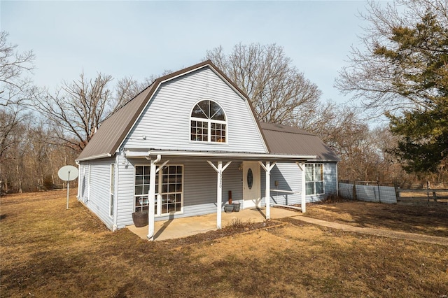 view of front of property with a patio area and a front yard