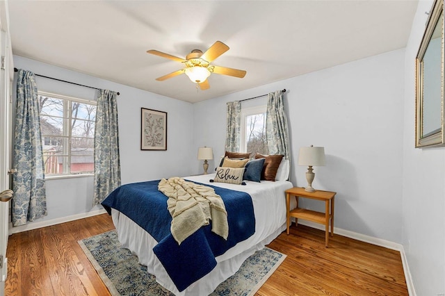 bedroom featuring hardwood / wood-style flooring and ceiling fan