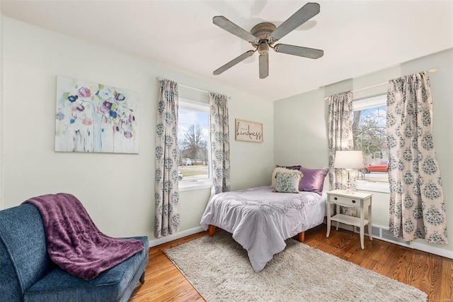 bedroom featuring wood-type flooring and ceiling fan