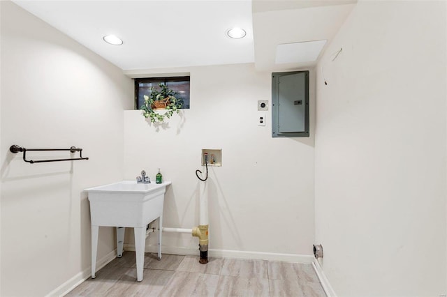 clothes washing area featuring electric dryer hookup, hookup for a washing machine, and electric panel