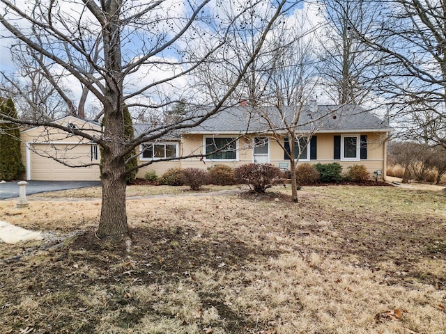 ranch-style house featuring a garage