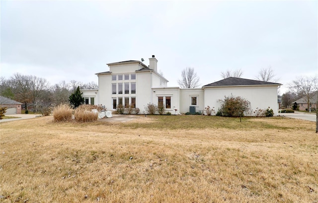 rear view of house with a yard