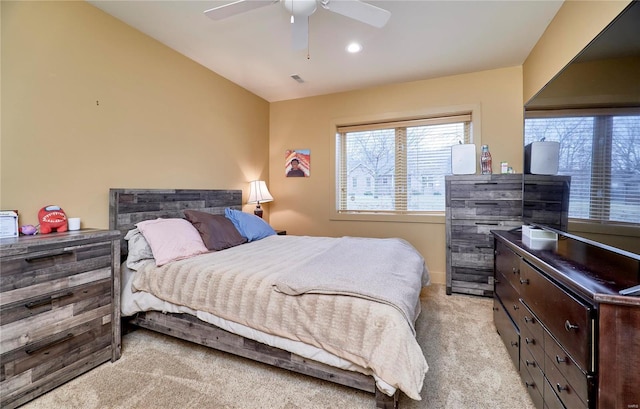 carpeted bedroom featuring ceiling fan