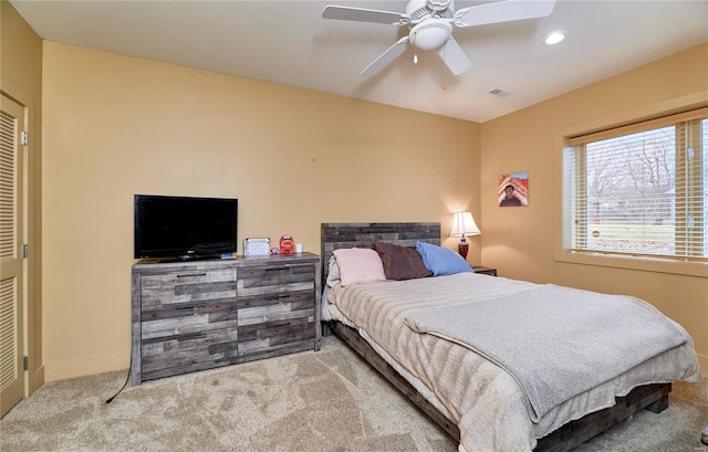 bedroom with ceiling fan and carpet