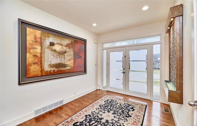 entryway featuring french doors and hardwood / wood-style floors