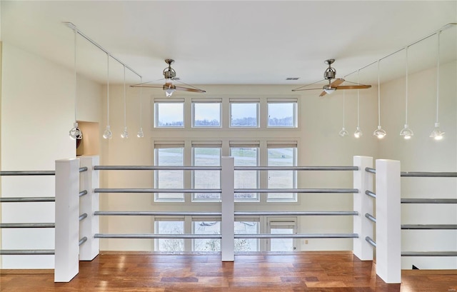 interior space featuring hardwood / wood-style floors and ceiling fan