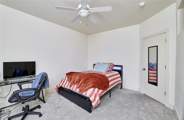 carpeted bedroom with ceiling fan