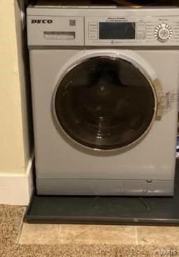 laundry area with washer / dryer