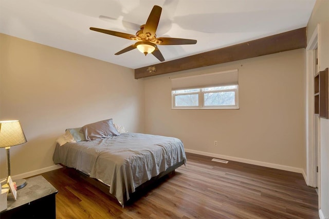 bedroom with ceiling fan and dark hardwood / wood-style flooring