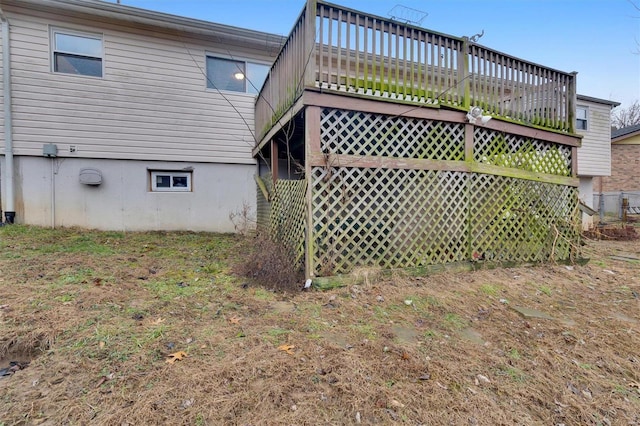 back of property featuring a wooden deck