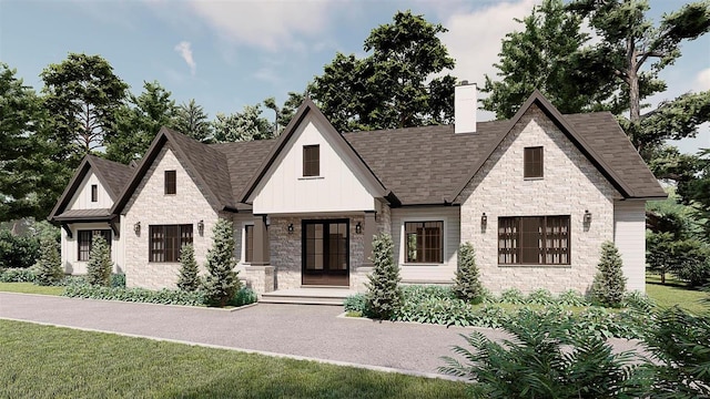 view of front facade featuring french doors and a front yard