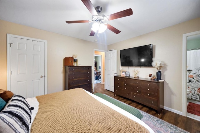 bedroom with dark hardwood / wood-style flooring and ceiling fan