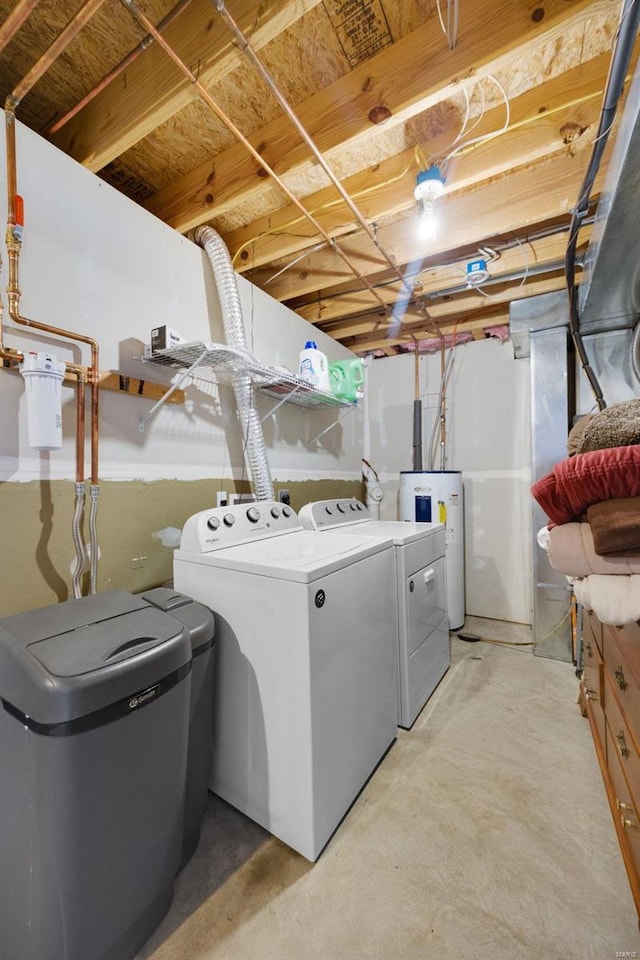 laundry area with washing machine and dryer and electric water heater